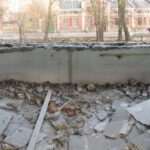 ruins of a building in front of a window. Area needs selective demolition.