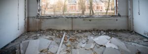 ruins of a building in front of a window. Area needs selective demolition.